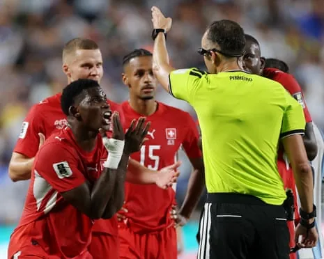 Switzerland’s Breel Embolo pleads his case after being shown a second yellow card for simulation in the 2026 World Cup quarter-final against Argentina