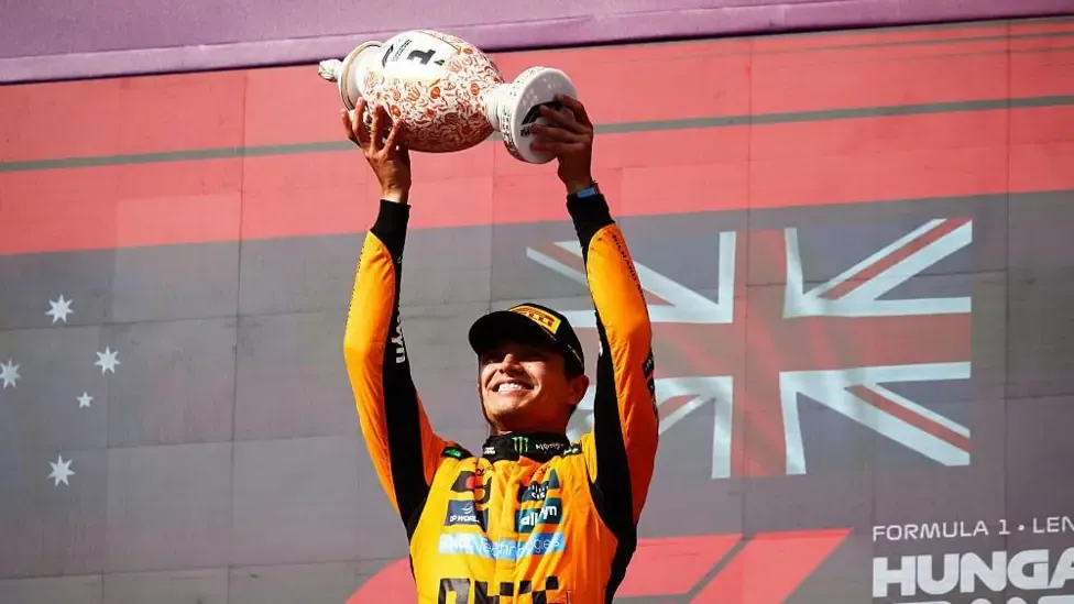 Lando Norris lifting the trophy on last year's Hungarian Grand Prix podium