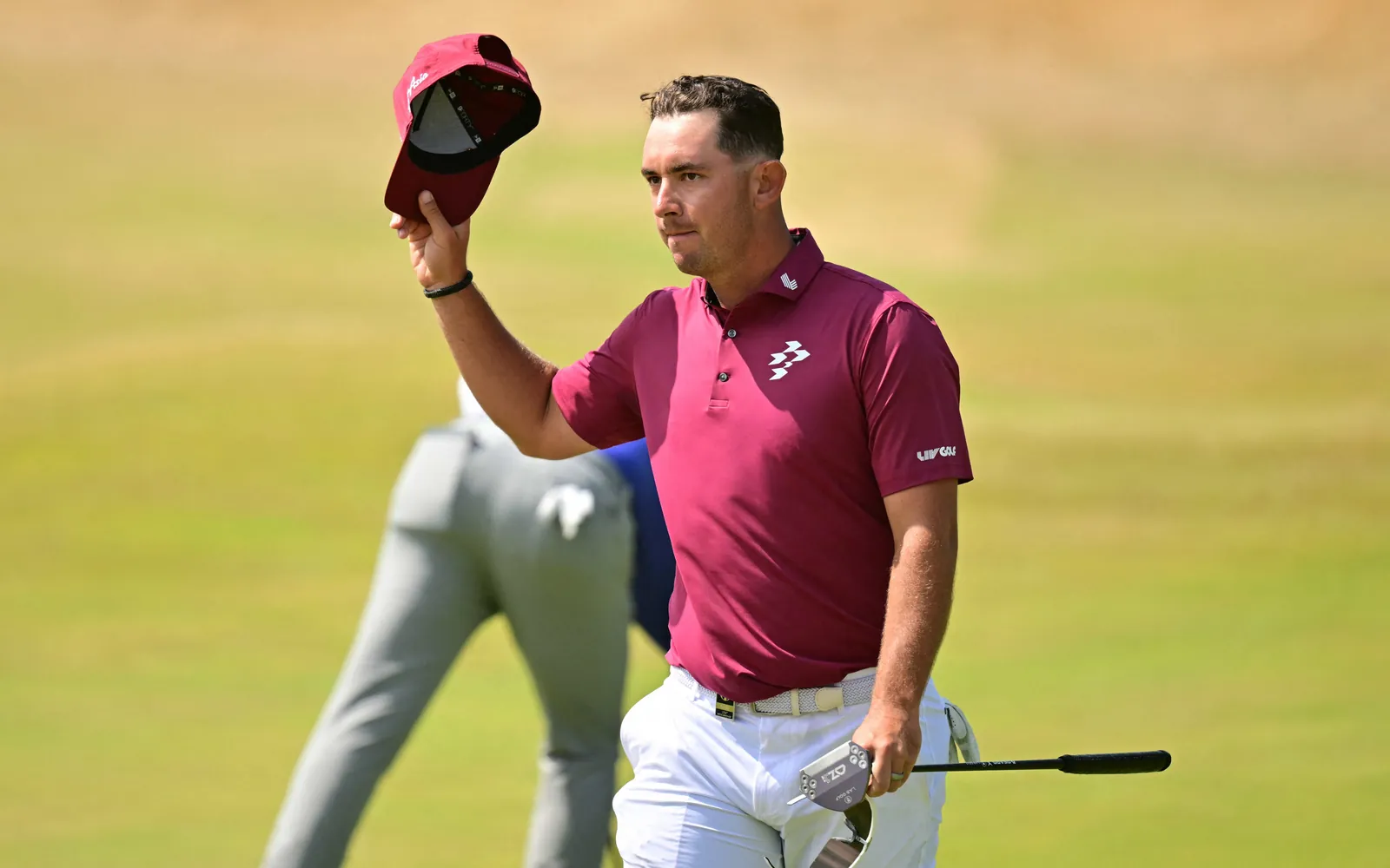 Australia's Lucas Herbert reacts on the 18th green after his -8, 62, tying the Open Championship low score record on day two of the 154th Open Golf championship at Royal Birkdale Golf Club near Southport in north-west England on July 17, 2026. (Photo by ANDY BUCHANAN / AFP) / RESTRICTED TO EDITORIAL USE